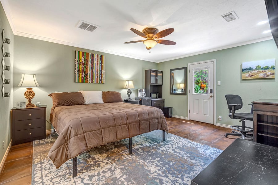 Primary Bedroom  California King Bed, TV, Desk, Kitchenet with private entrance.