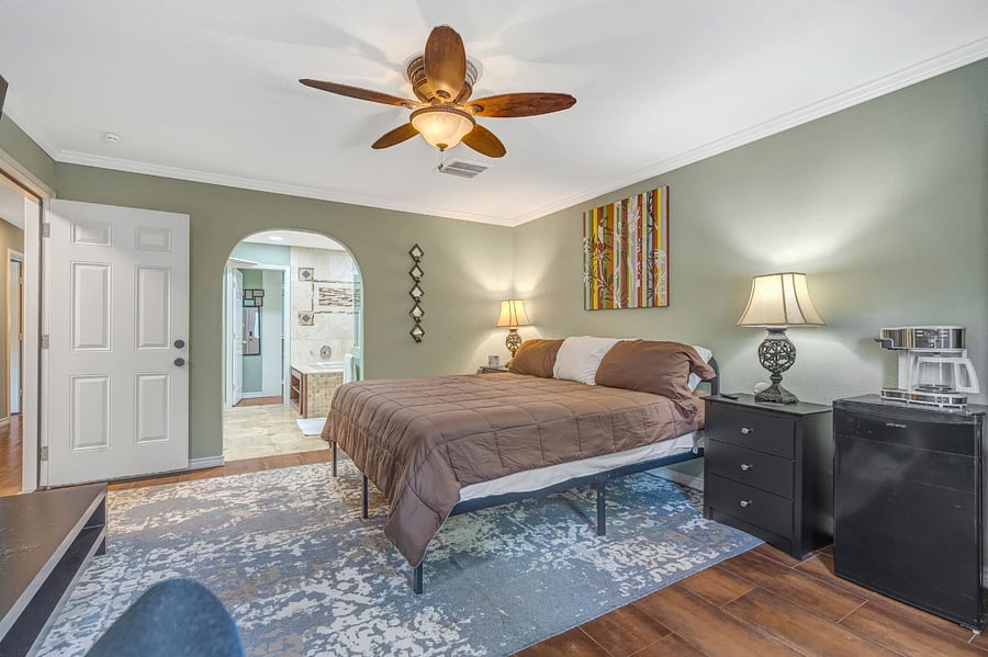 Primary Bedroom  California King Bed, TV, Desk, Kitchenet with private entrance.