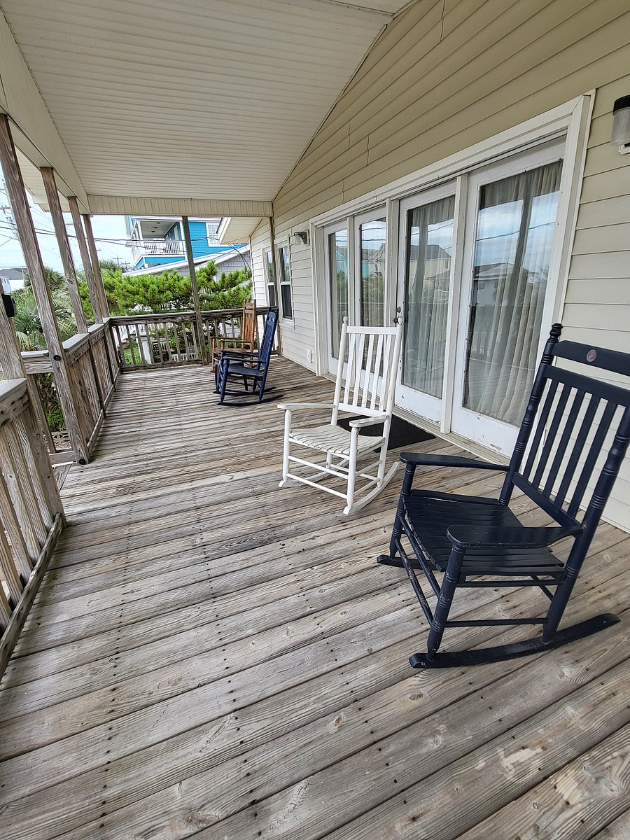 Relax on the front porch with an ocean view -- the beach is across the street!