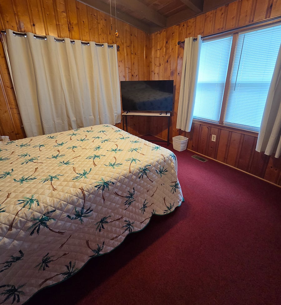 Bedroom 1 also has a queen size bed, plus an additional smart TV.