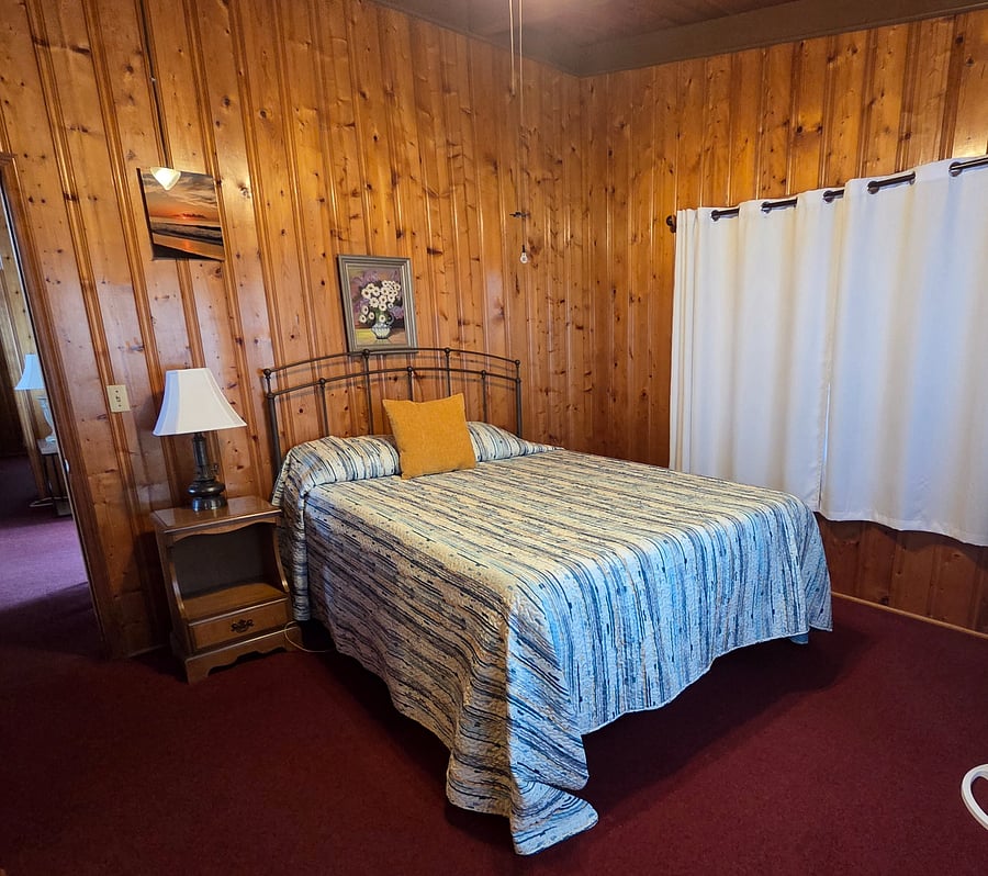 Bedroom 3 has a queen sized bed, chest of drawers, dresser, and A dcloset. 