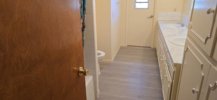shared bath. Two sinks, tub & shower. Lots of drawer and storage space.