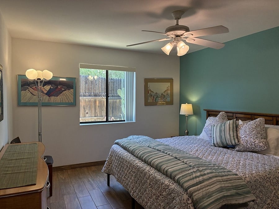 Bedroom with view of backyard.