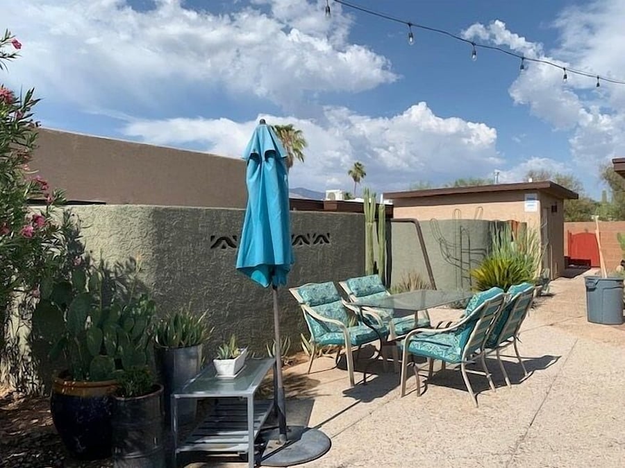 Outdoor dining area near pool.