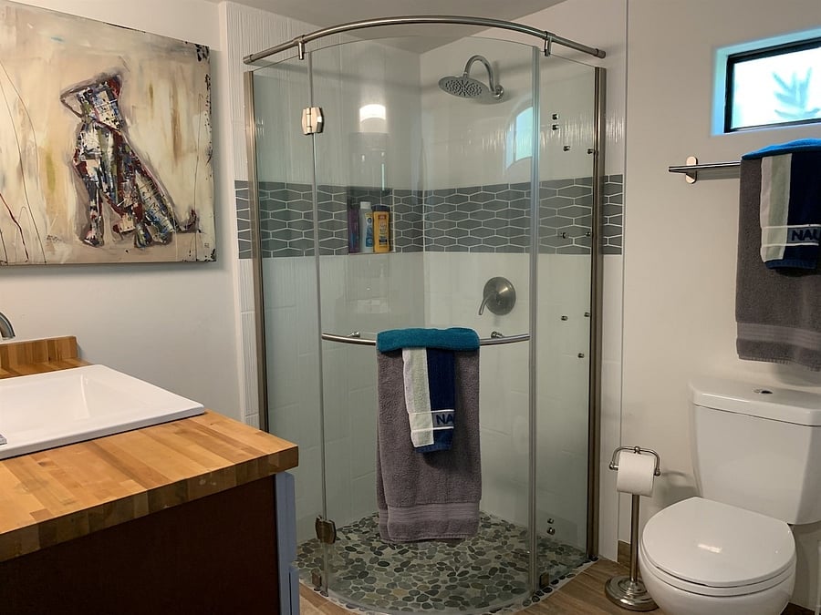 Bath with walk in shower.
