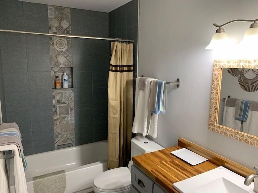 Bathroom with tub and shower.