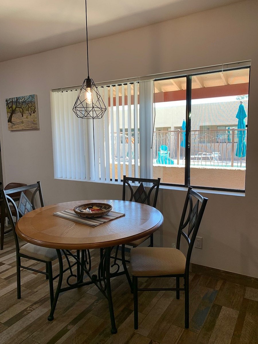 Dining table with view of pool area. Window treatment closes completely for maximum privacy.
