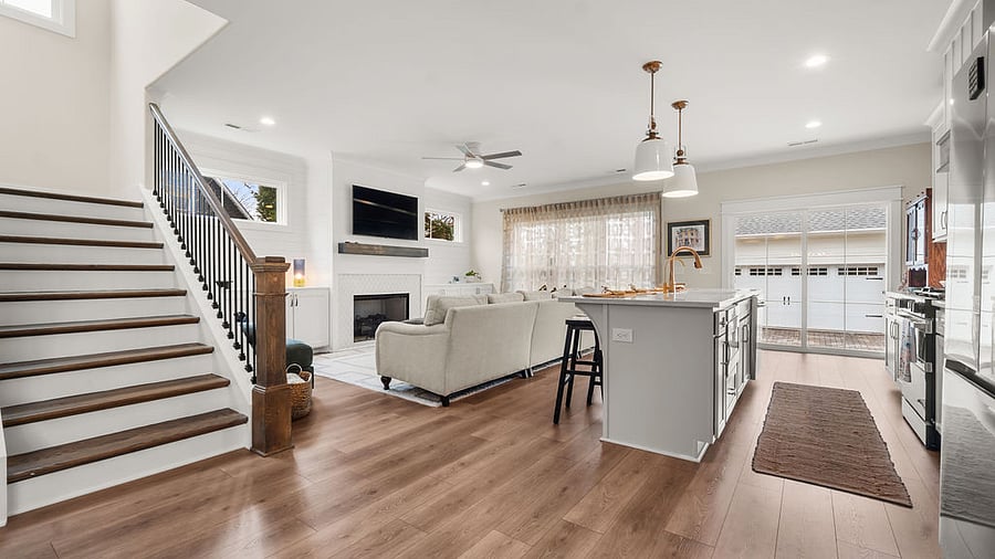 Main Floor: fireplace, views to covered back porch and basket swings - views of detached garage 