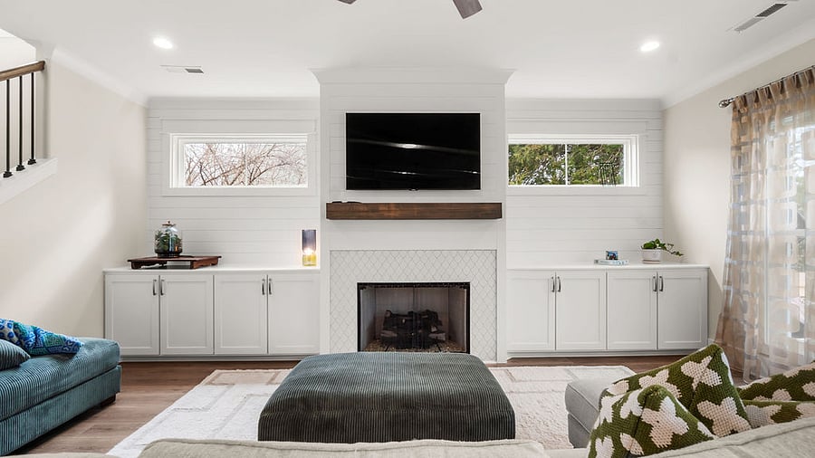 fireplace and lovely windows for light and privacy 