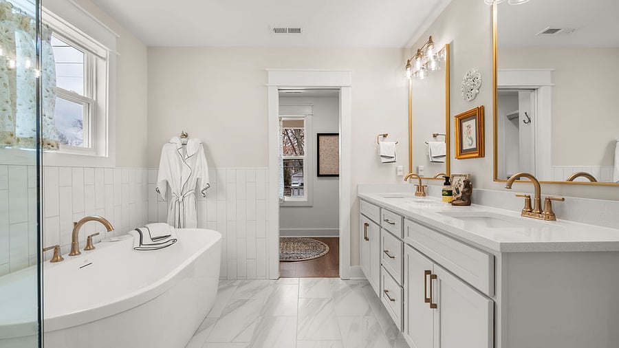 Second Floor Primary Suite Bath with Water Closet and storage closet - morning light window