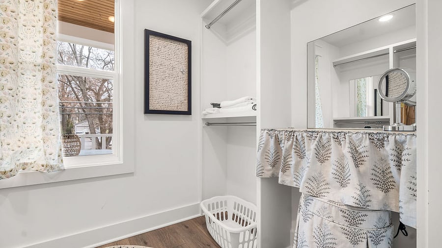 Second Floor Primary Suite closet with morning sun and a makeup station, fire extinguisher 
