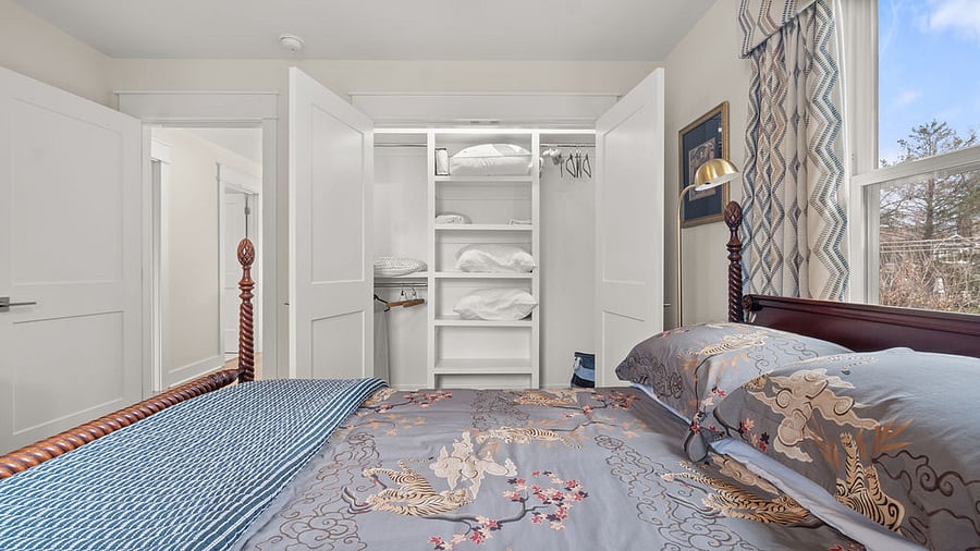 Interior views of the second floor, full-size bedroom with additional sheets, bedding, and pillows for back sleepers or side sleepers, contour pillows by serta 
