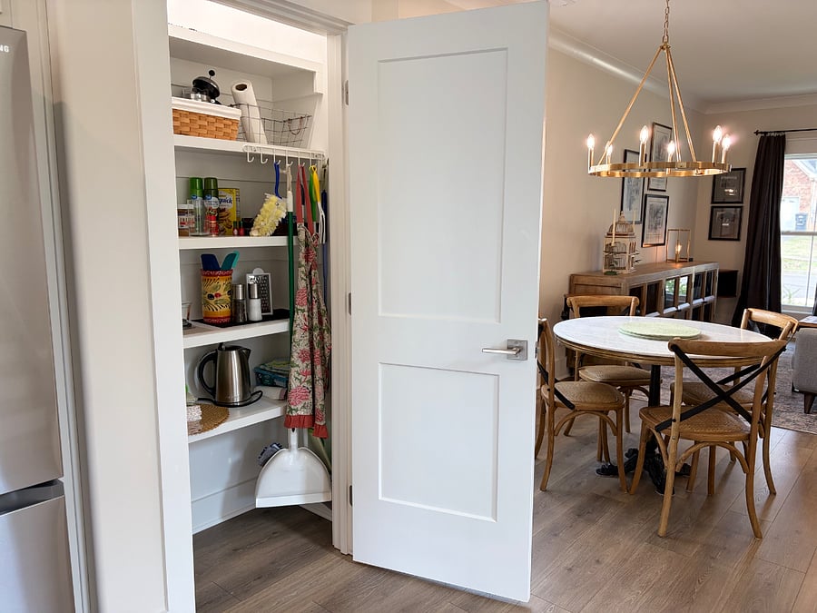 First Floor Kitchen Pantry with starting supplies for cleaning and pantry staples, dishware, vases, serving plates, storage containers 