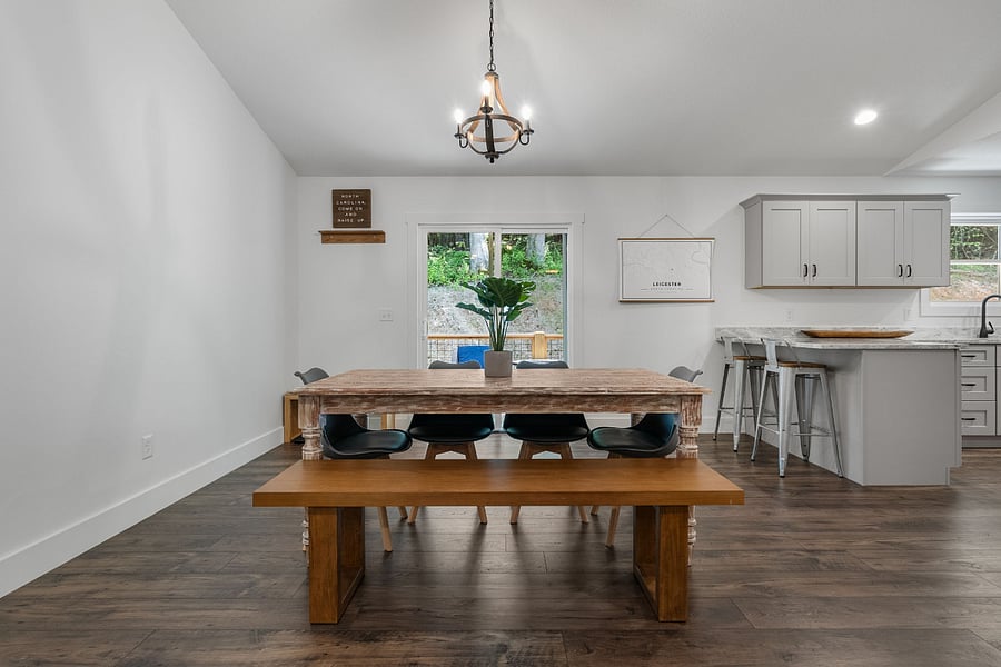 Kitchen / dining room table that can fit up to 6-8 people. Please note - the bench has been replaced with matching chairs.