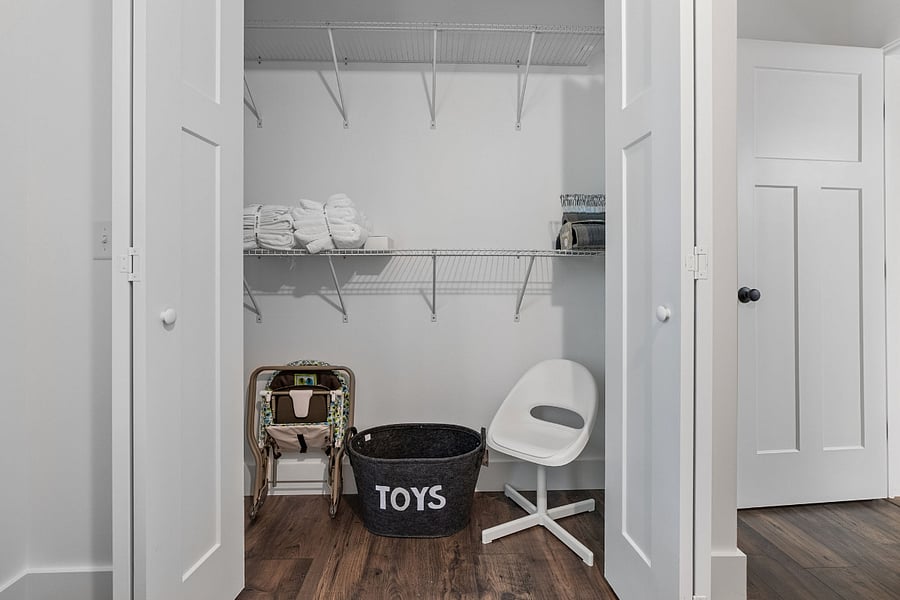 Bedroom storage (kids toys, pack and play are located here).