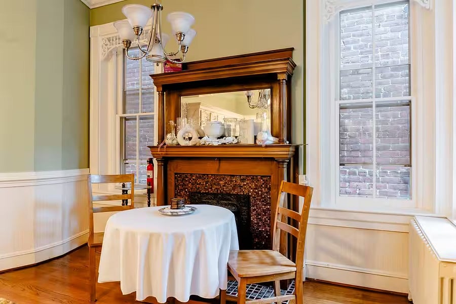 Cozy fireplace situated in the breakfast area.