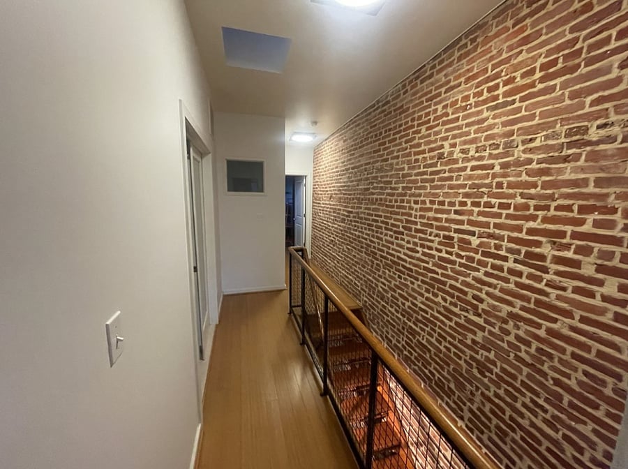 2nd floor hall space between bedrooms, features a skylight