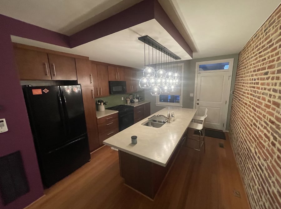 kitchen has a large island ideal for those who like to cook, gas stove, fridge, microwave, dishwasher, toaster oven, garbage disposal and blender. 