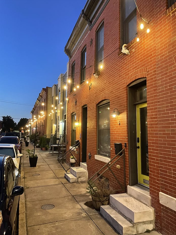 Neighborhood has put up bistro lighting for a romantic ambiance 