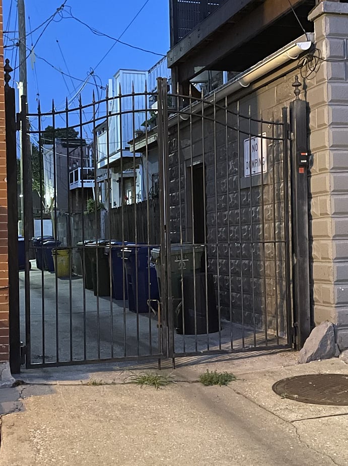 the block shares a gated alley with remote control access at the north end. Alley is clean and well maintained communal space