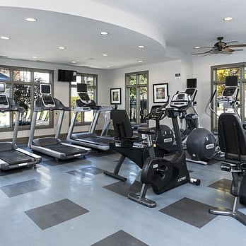 A gym next to the smaller swimming pool.