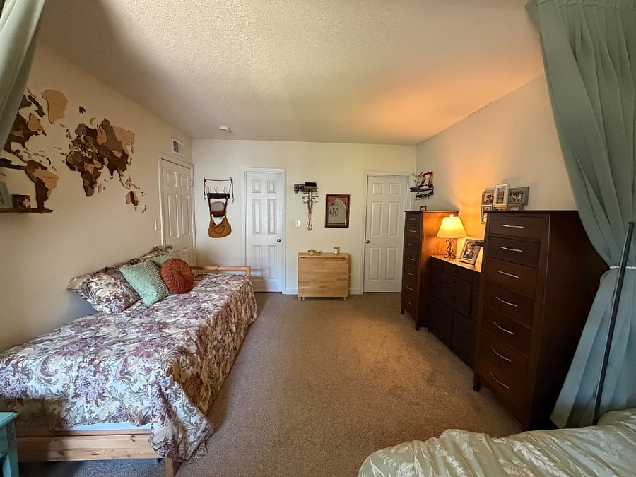Other half of the room has a twin size bed that can extend into a king size for guests.