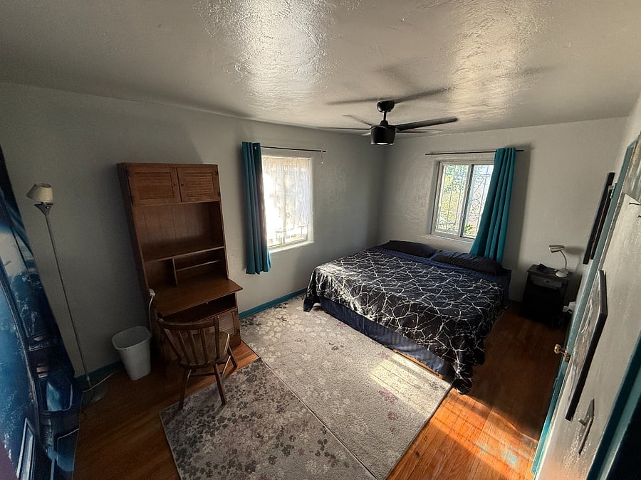 Spacious room with Desk and Chair, King Sized Bed and view of Sandia Mountains  