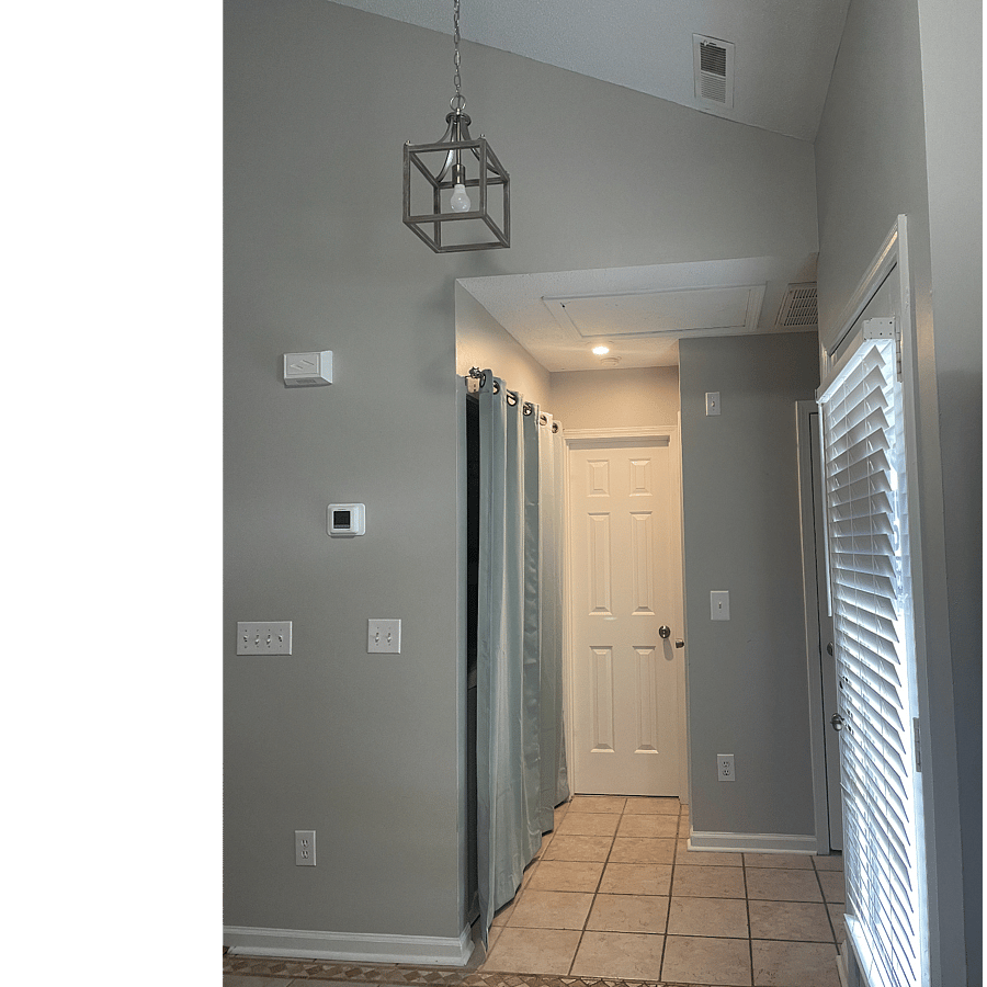 Hallway to in-unit washer/dryer and guest bathroom