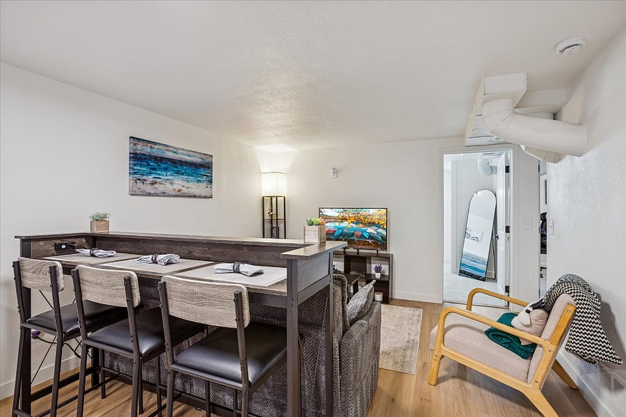 The kitchen, dining area, and living room are all arranged in an open-concept layout.