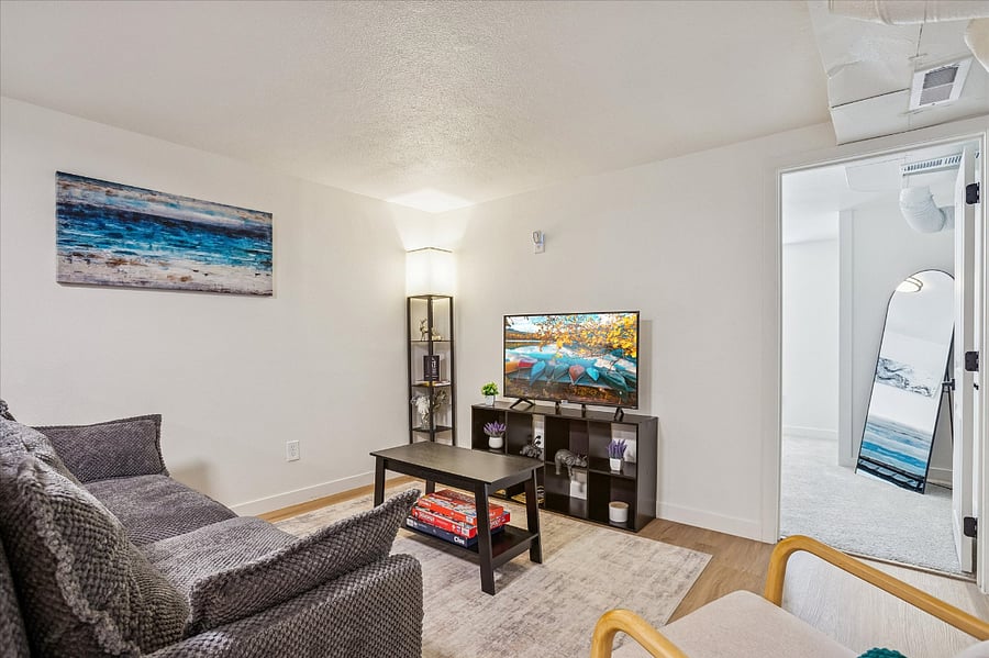 There is a smart TV equipped with popular streaming apps, as well as a selection of board games for entertainment.