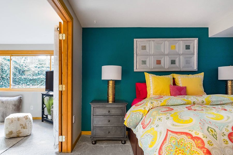 Southwest basement bedroom with french doors leading into basement living room