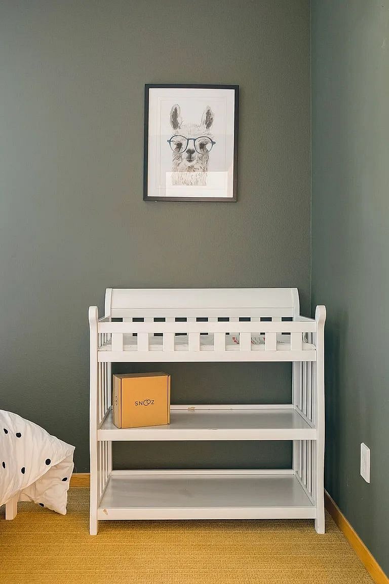 Baby changing table in twin bedroom