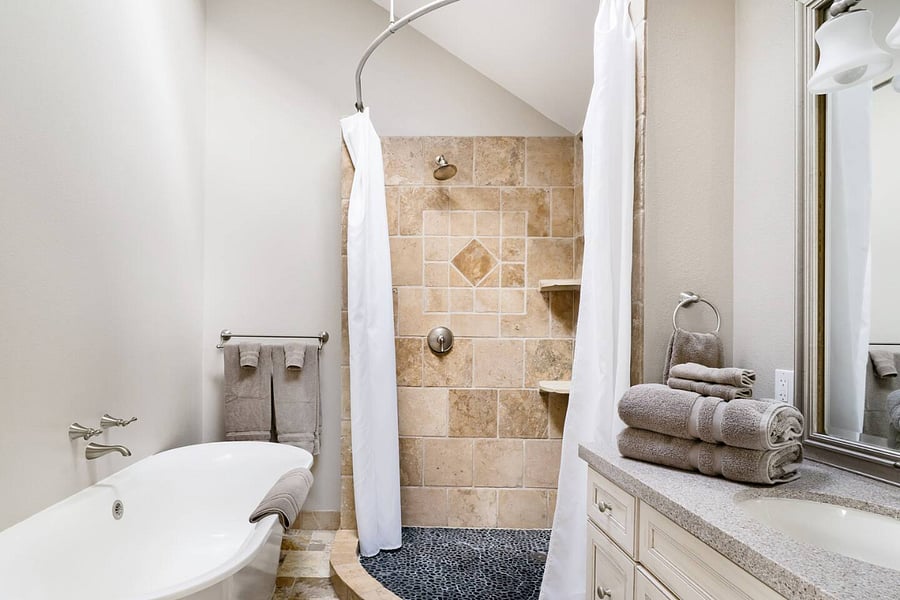 Skylight over tub providing ample natural lighting in ensuite bathroom