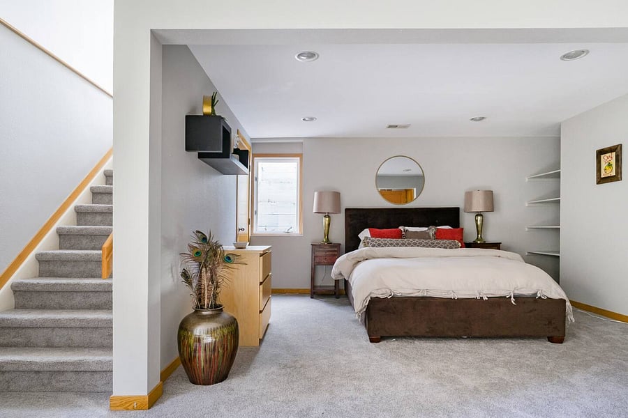 Northeast basement bedroom with separate stair access to outside.