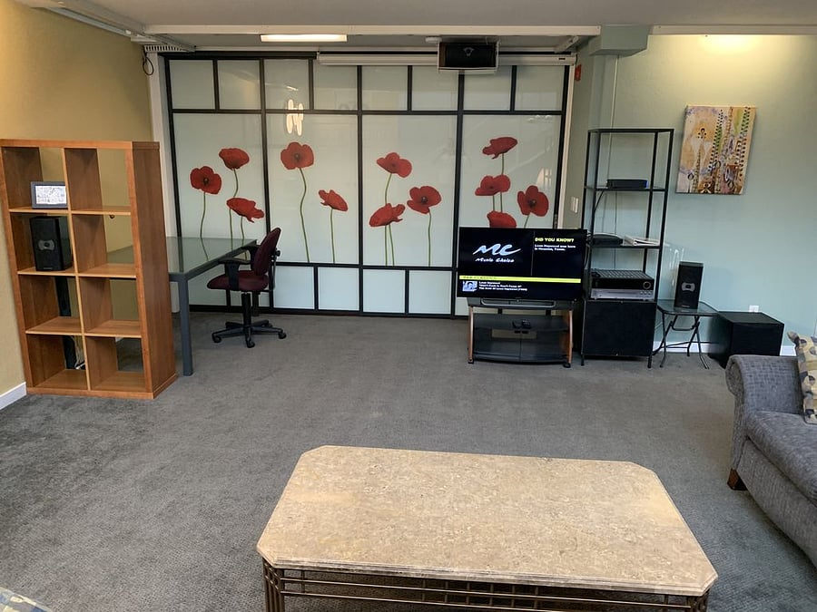 Lower-level living room with divider closed