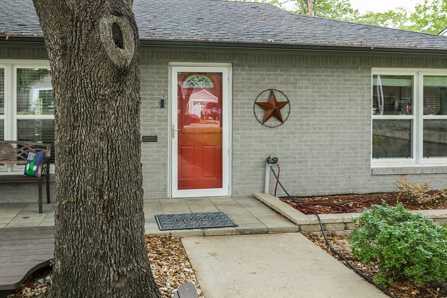 Front entrance is fairly level with a couple of small steps. Entry through garage has 3 steps