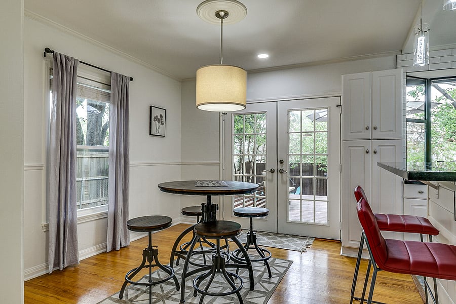 Dining area with door to backyard and back deck.