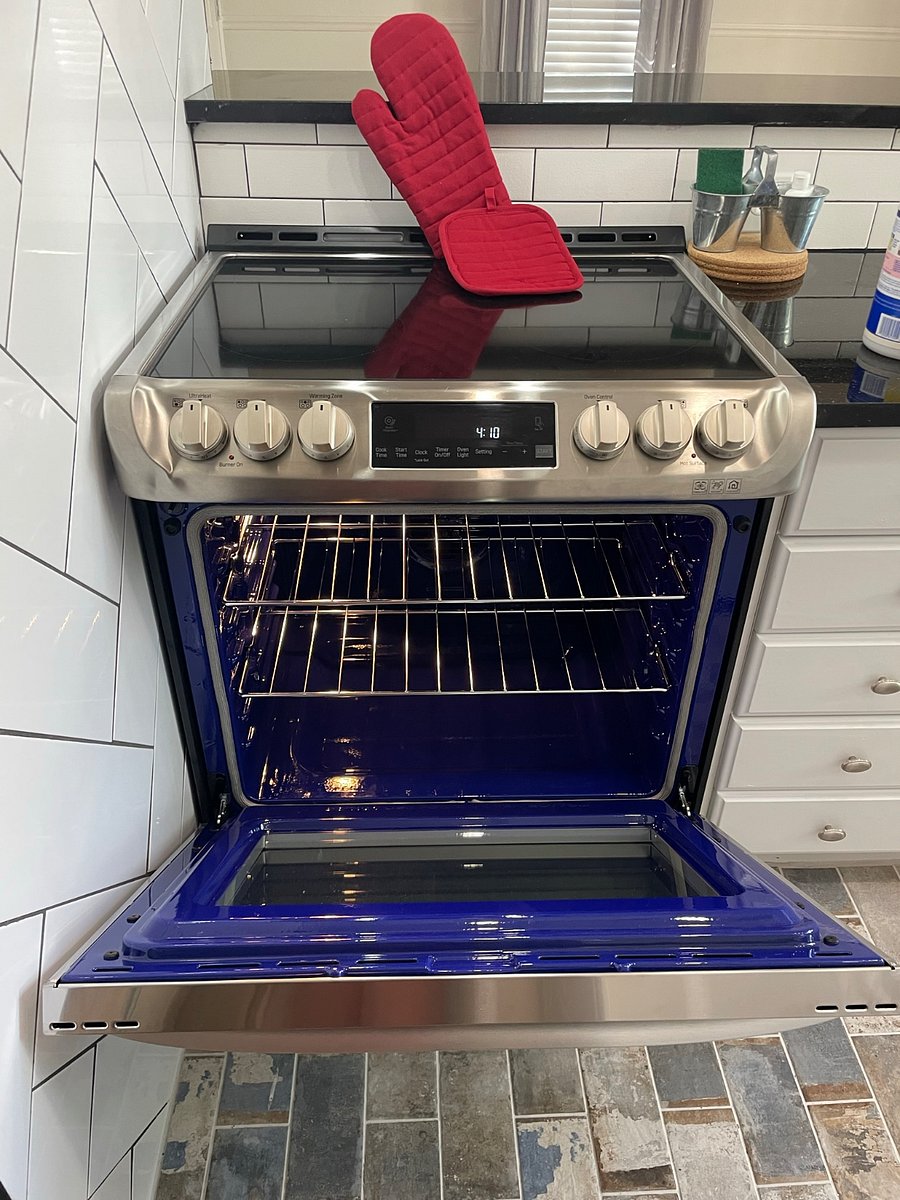 New LG electric oven and stovetop with overhead vent hood