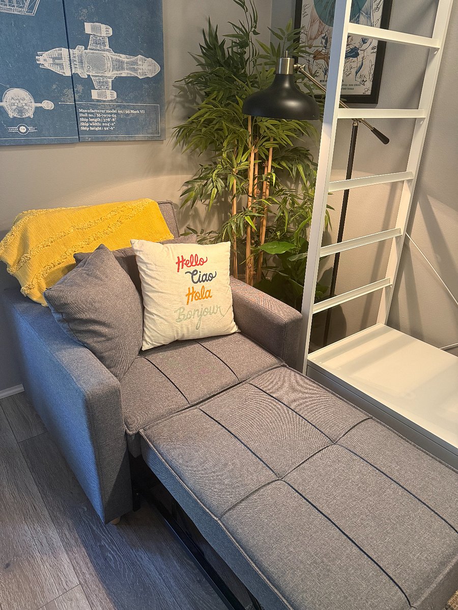 Loveseat pulled out into a twin size bed or lounger.