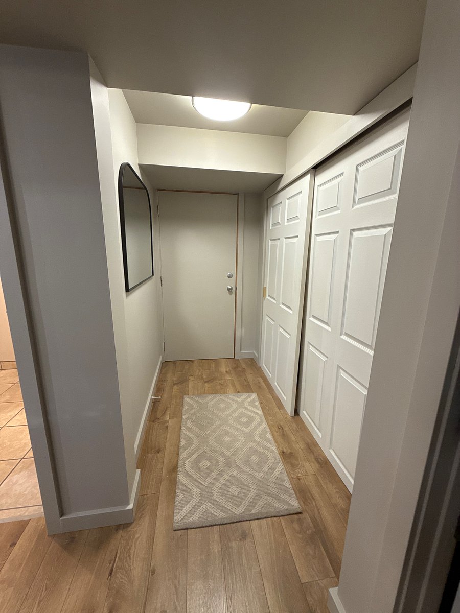 Exit to hallway leading to private washer and dryer