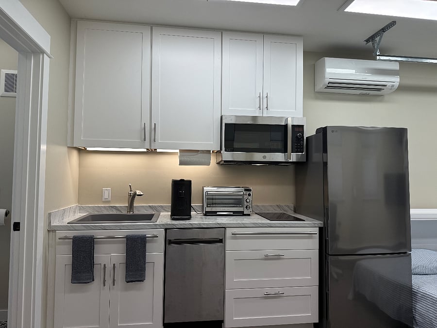 Kitchen Area
Under sink drinking water filter faucet
Sink
Coffee maker
Large Toster oven
Microwave/Convection oven
Two burner Induction cook top
Refrigerator/Freezer
Mini Split very quiet A/C wall unit