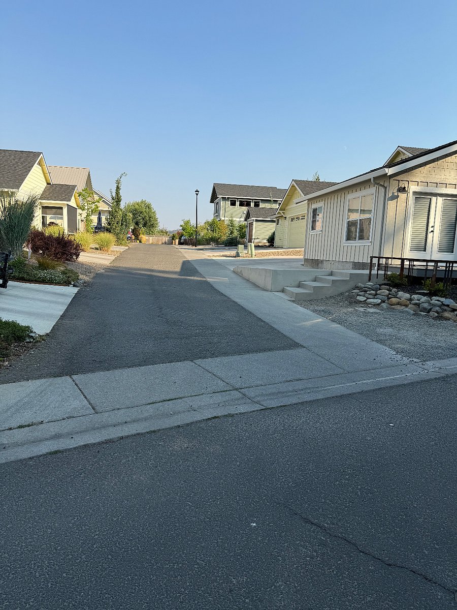 View of road to Carriage House from Creek-Side Park.