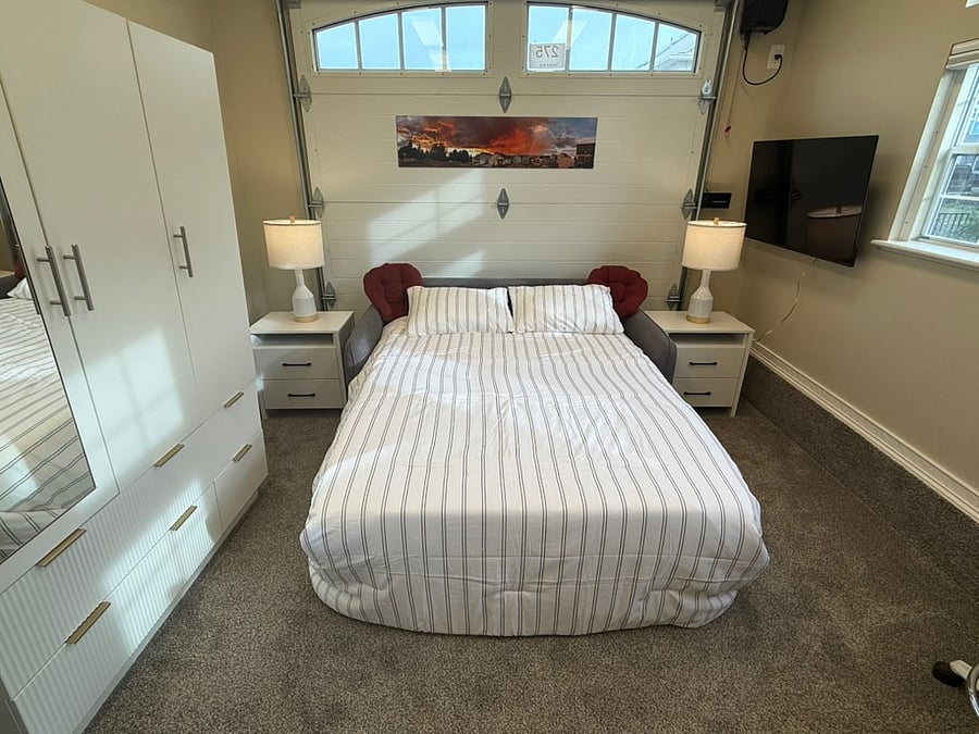 Easy open Sofa Sleeper,
Bed extended, in bedroom configuration, wide angle picture.
The bed's mattress is a 4 inch premium-quality memory foam
Plus there is an added 2 inch topper available.
Notice the TV on the right side of the room.