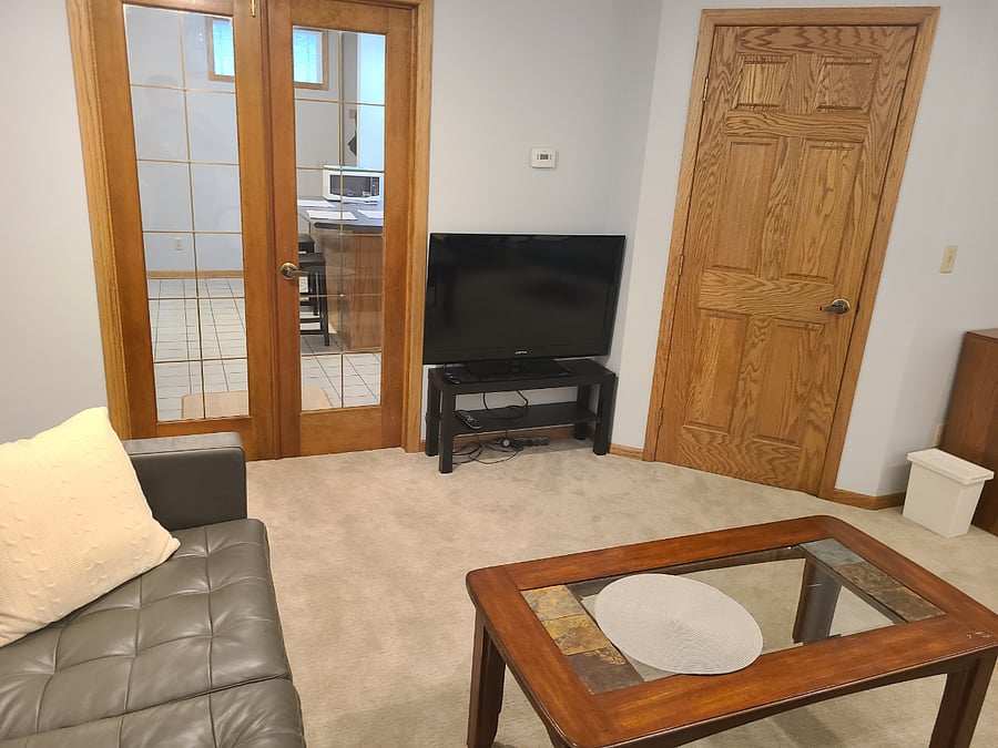 Living room w/ French doors to kitchen