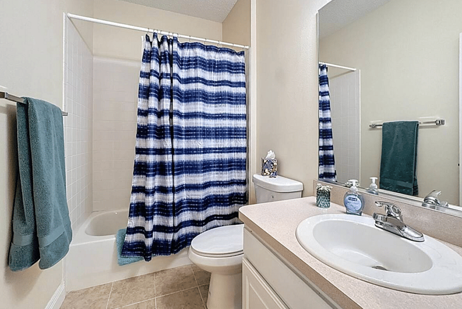 Other bathroom across from second bedroom with bathtub