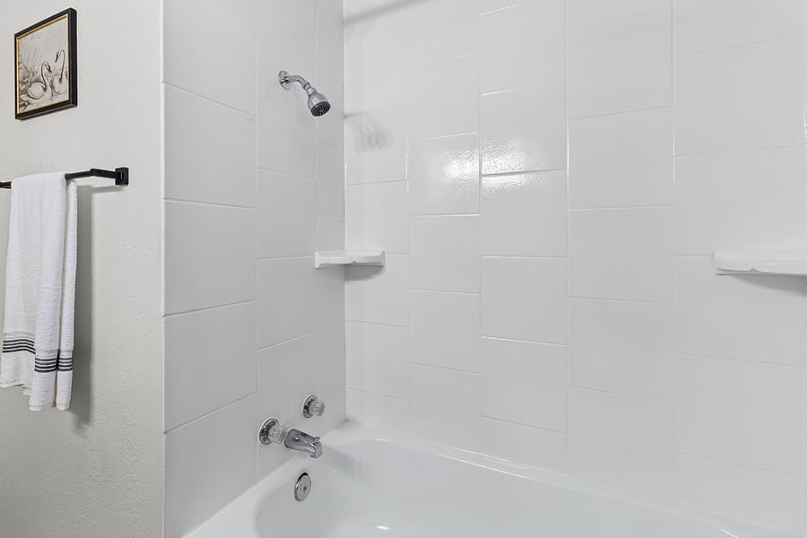 Clean, modern bathroom with fresh towels and essentials provided.