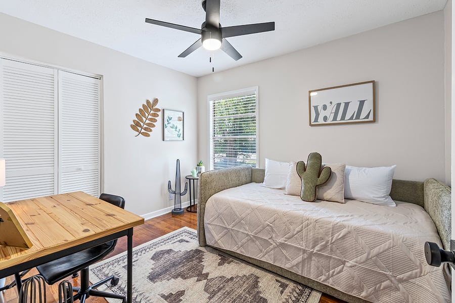 Second bedroom with workspace, equipped with bed and trundle.