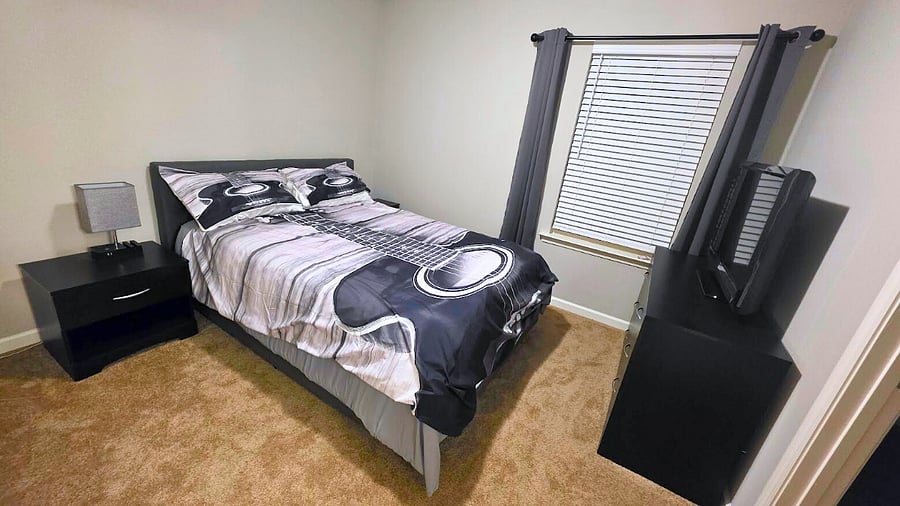 Queen size bed, foam mattress pad and blackout curtains.