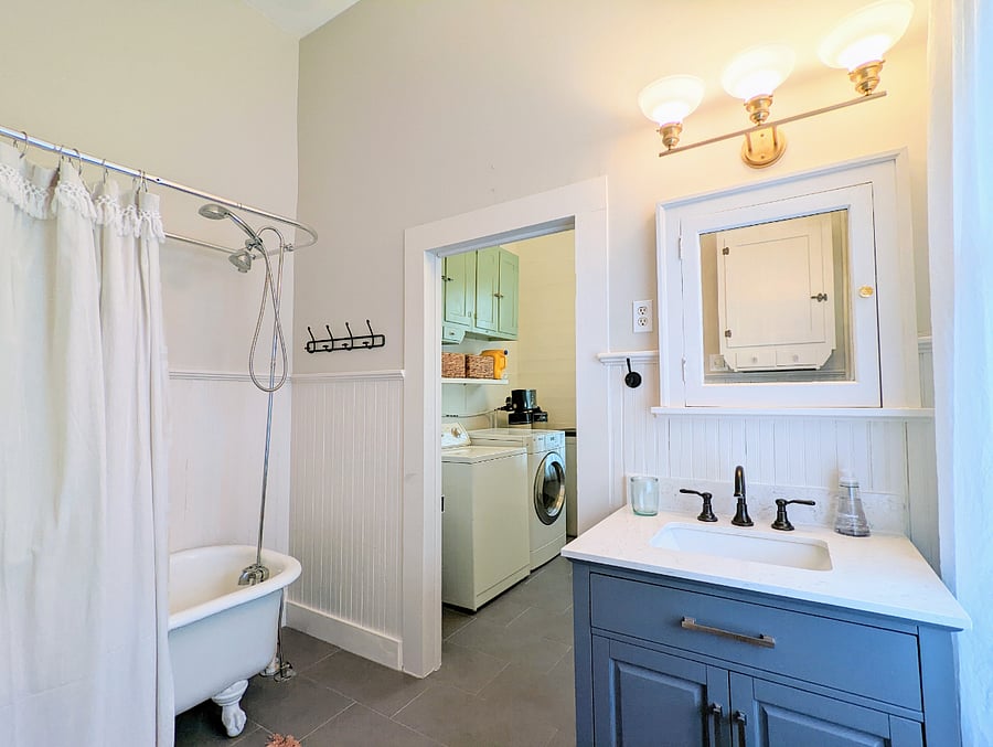 Darling full bath with clawfoot tub-shower