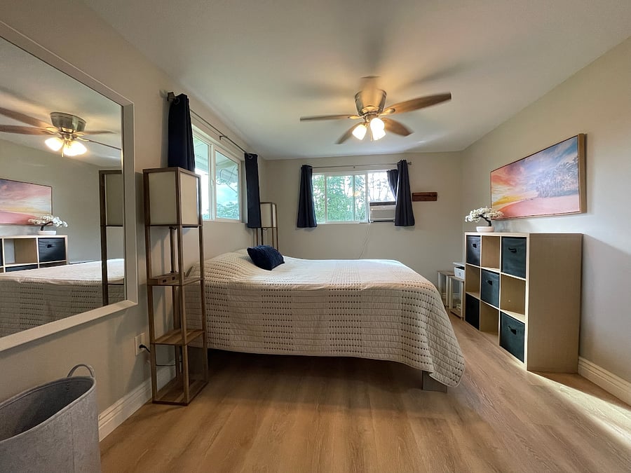 Bedroom #1 features a queen size bed, air conditioning, double paned windows, a printer and plenty of storage space.